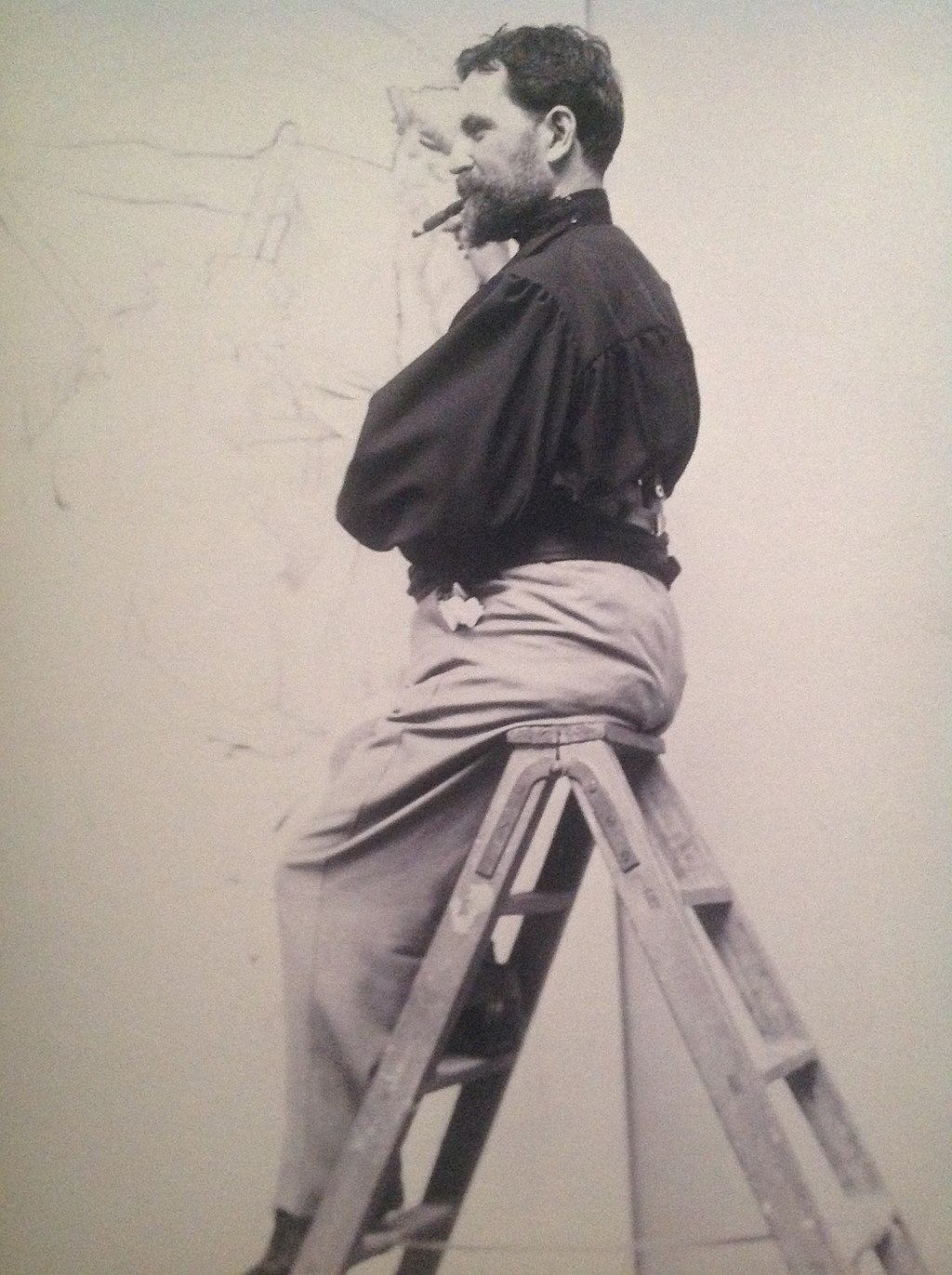 Alphonse Mucha working on a poster for publishing house Cassan (1896)