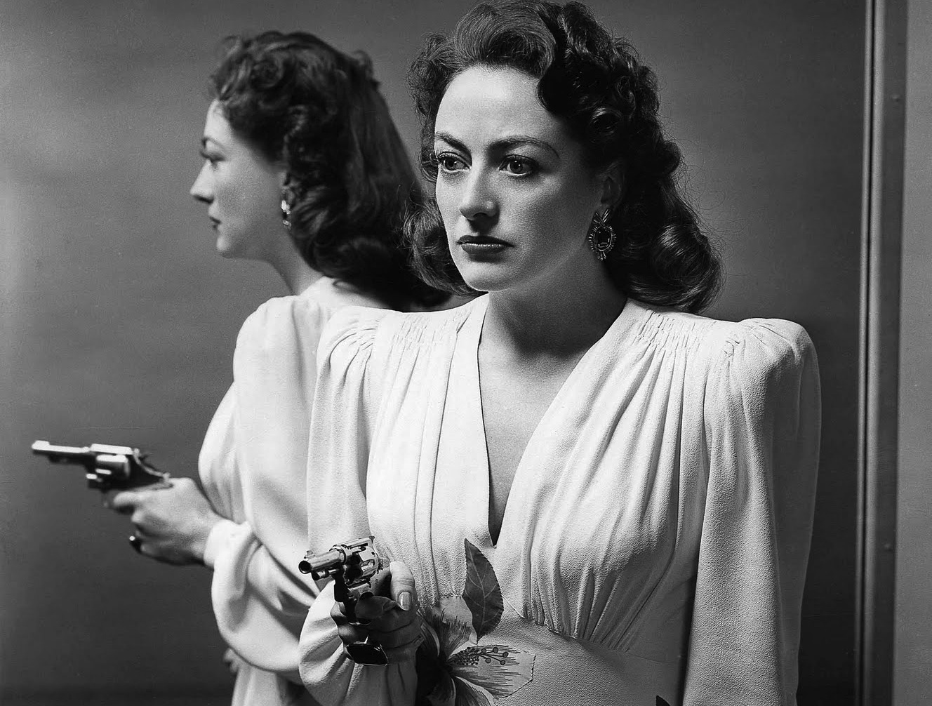 Joan Crawford in film Mildred Pierce(1945), costume by Adrian