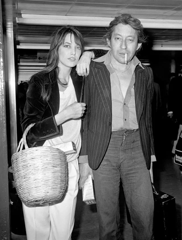 Jane Birkin carrying a straw basket, with Serge Gainsbourg