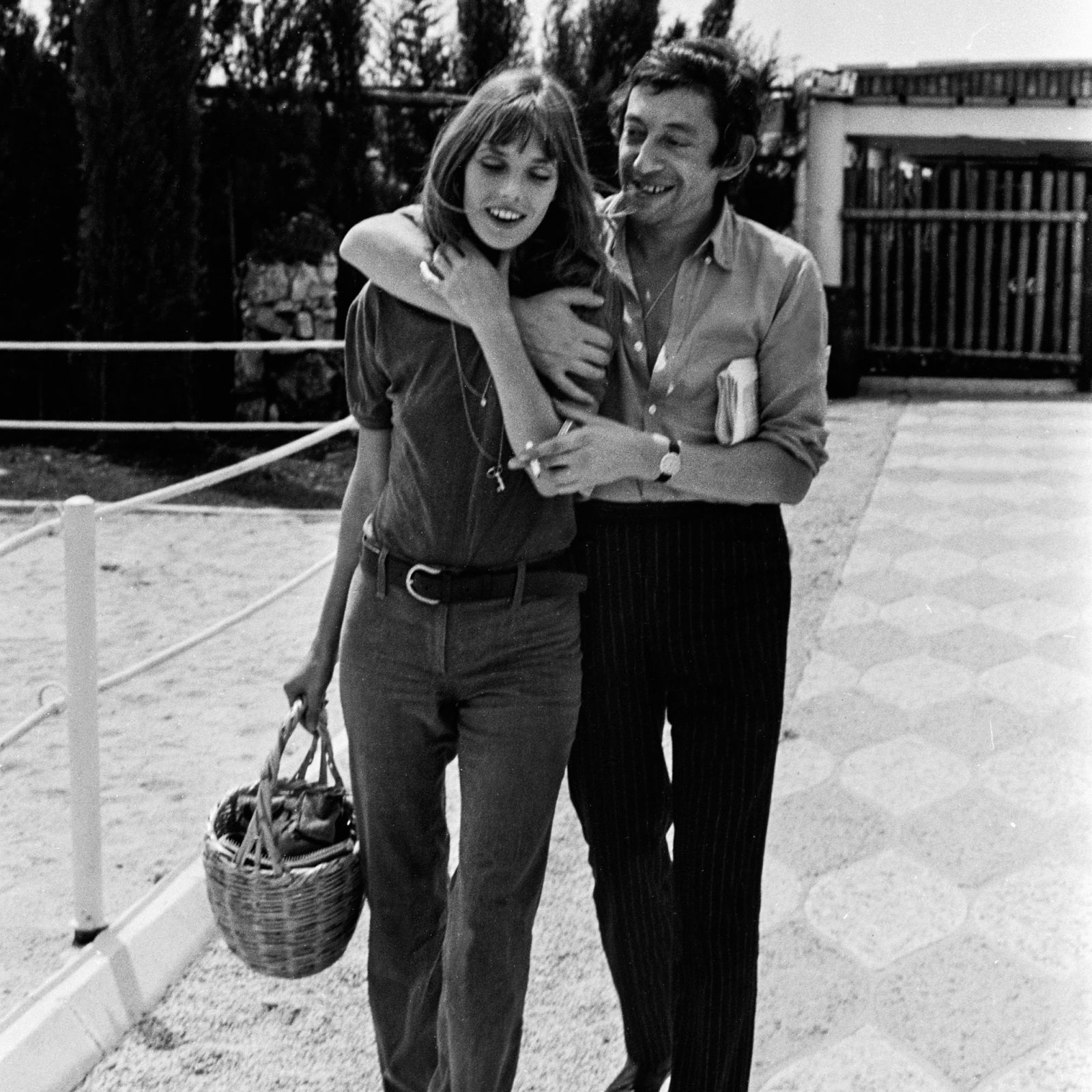 Jane Birkin carrying her omnipresent wicker basket, with Serge Gainsbourg
