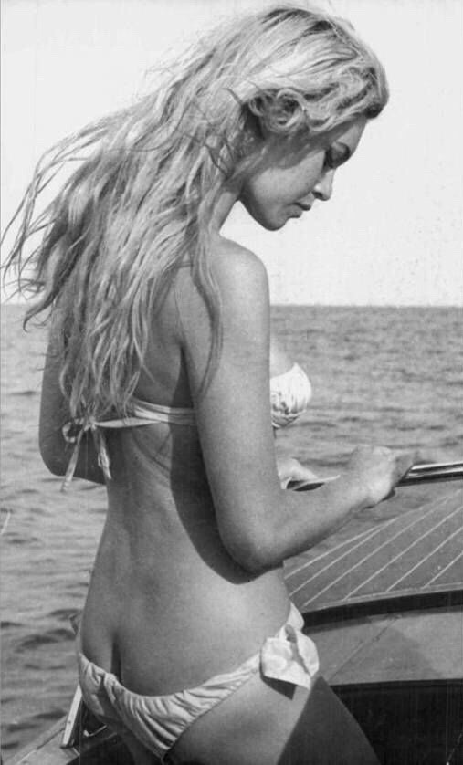 Elegant style icon wardrobe essentials: Brigitte Bardot in swimwear, a two piece bikini in white