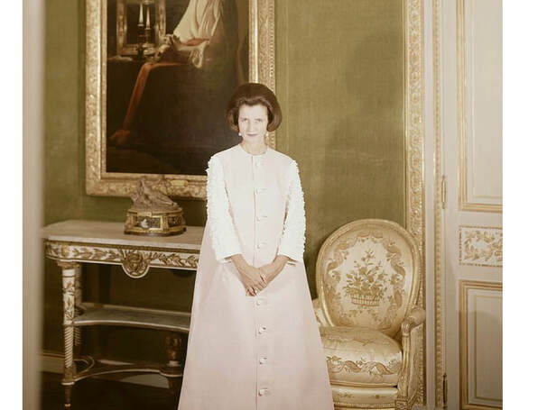 Jayne Wrightsman in pink Balenciaga overcoat at home on Fifth Avenue(on the wall Georges de La Tour's The Penitent Magdalen (c. 1640), photo: Cecil Beaton