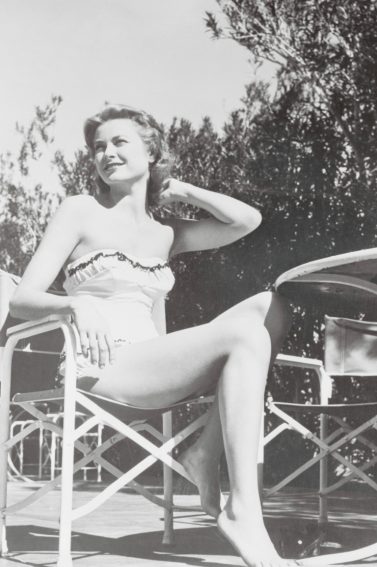 Elegant style icon wardrobe essentials: Grace Kelly in swimwear, a satin one piece strapless swimming suit