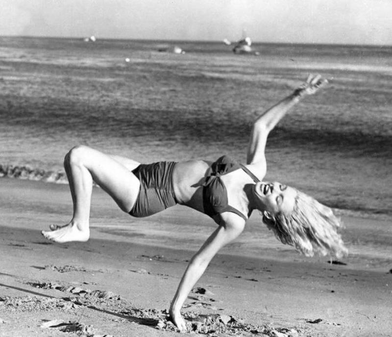 Elegant style icon wardrobe essentials: Marilyn Monroe in swimwear, a two piece bikini