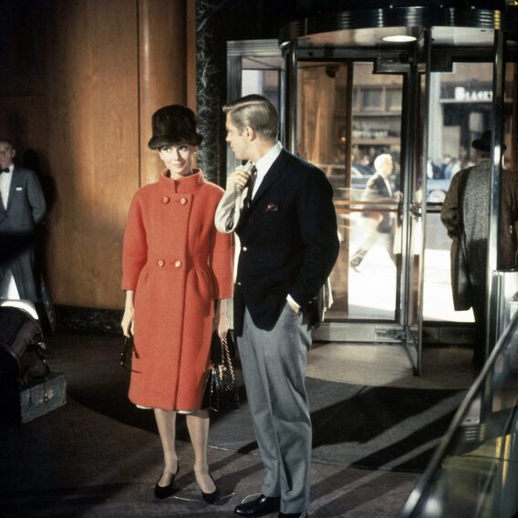 Audrey Hepburn movie costume in film Breakfast at Tiffany's(1961), the complete wardrobe of Holly Golightly:Orange double breast wool coat with standup collar and 3 quarter sleeves
