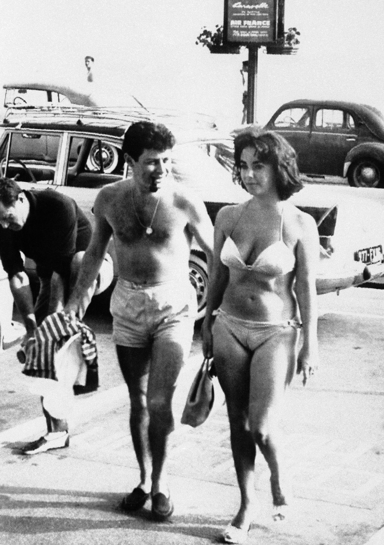Elegant style icon wardrobe essentials: Elizabeth Taylor in swimwear, a two piece bikini