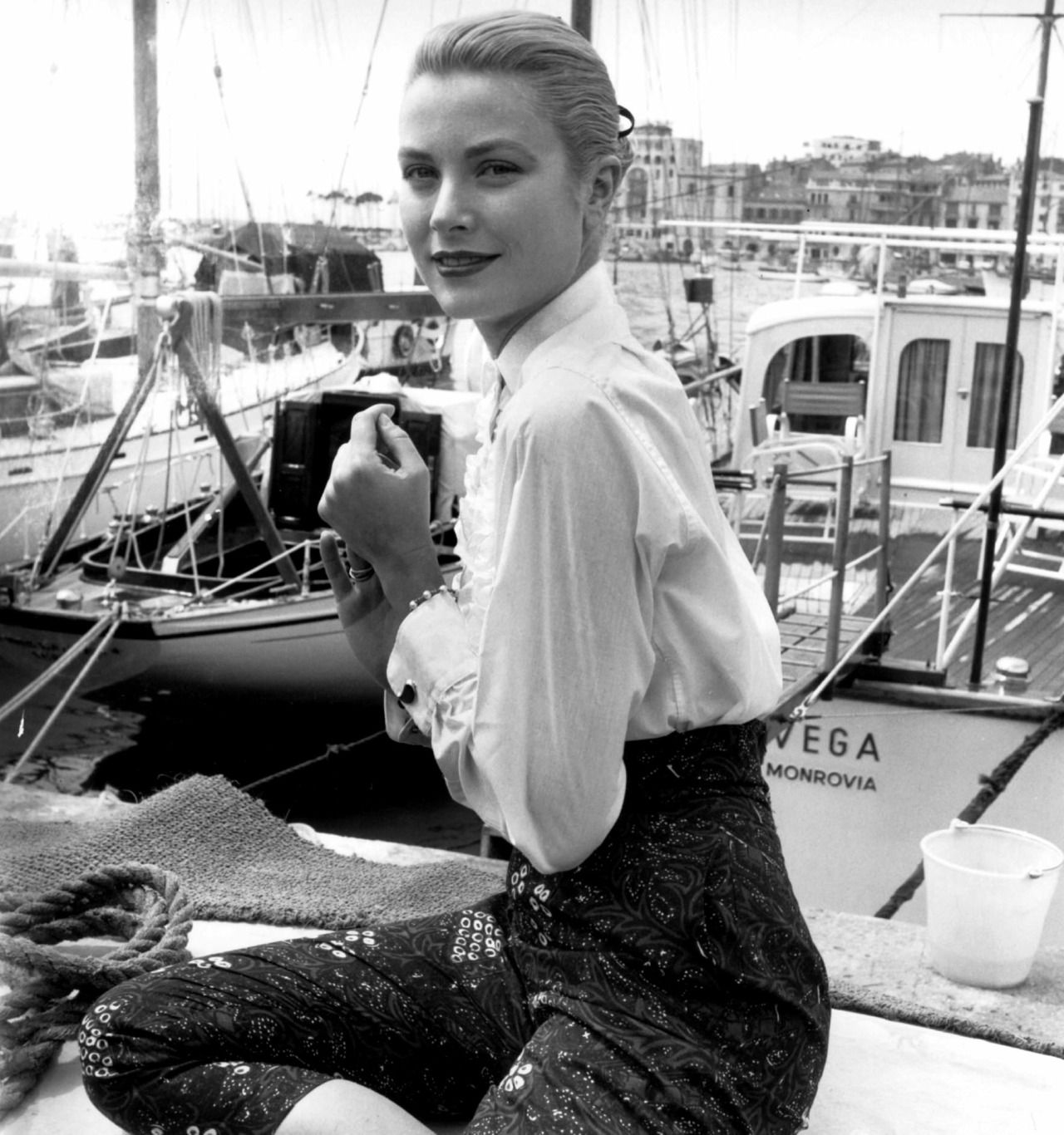 Grace Kelly in white shirt, Cannes film festival, 1955, photo by Edward Quinn