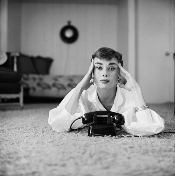 Audrey Hepburn in white shirt at home, photo by Mark Shaw