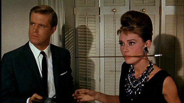 Audrey Hepburn movie costume in film Breakfast at Tiffany's(1961), the complete wardrobe of Holly Golightly:Black sleeveless knee length dress with tie belt and hem fringes