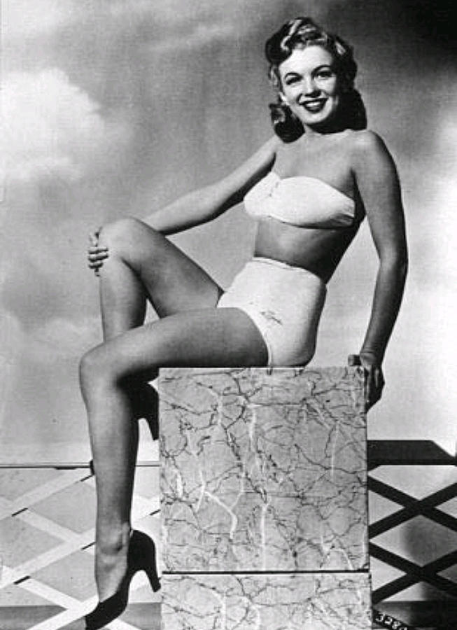 Elegant style icon wardrobe essentials: Marilyn Monroe in swimwear, a two piece strapless bikini