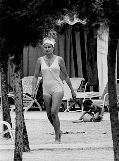 Elegant style icon wardrobe essentials: Grace Kelly in swimwear, a one piece white swimming suit
