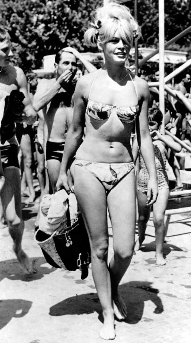 Elegant style icon wardrobe essentials: Brigitte Bardot in swimwear, a two piece bikini in floral print