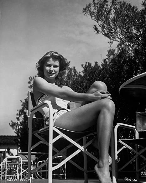 Elegant style icon wardrobe essentials: Grace Kelly in swimwear, a satin one piece strapless swimming suit