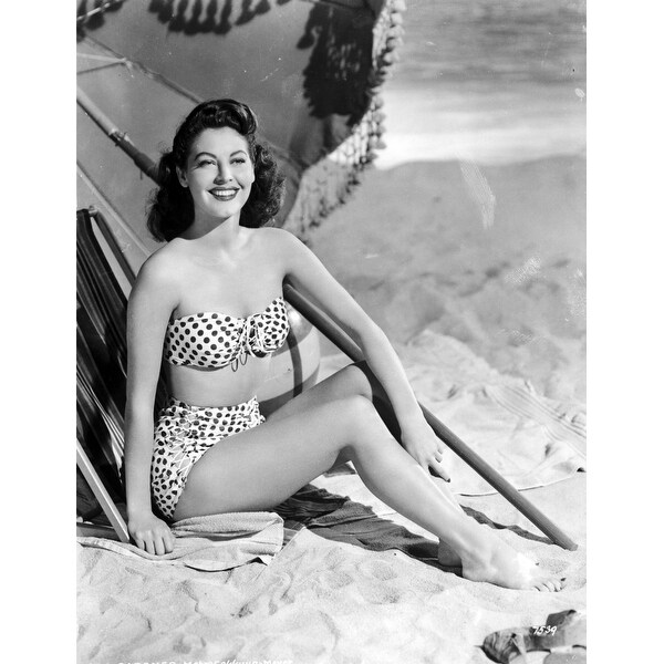Elegant style icon wardrobe essentials: Ava Gardner in swimwear, a two piece bikini in polka dot print