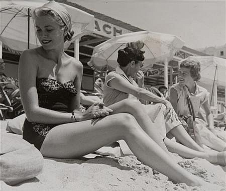 Elegant style icon wardrobe essentials: Grace Kelly in swimwear, a strapless lace one piece swimsuit, photo by Edward Quinn, 1954