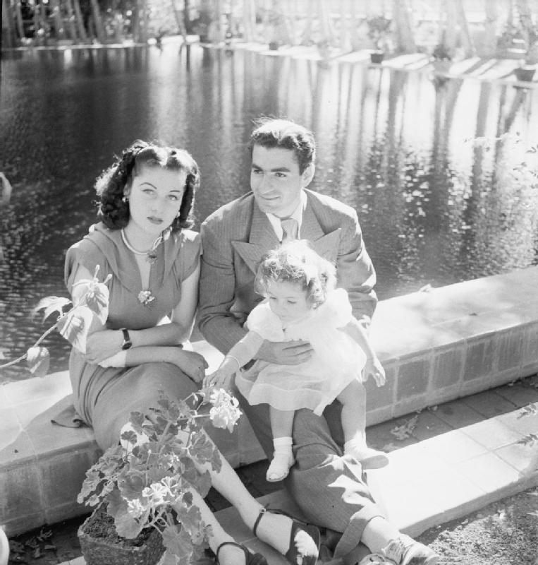 Queen Fawzia with Shah Mohammad Reza Pahlevi and their daughter, Princess Shahnaz in Tehran during the Second World War. Photo by Cecil Beaton