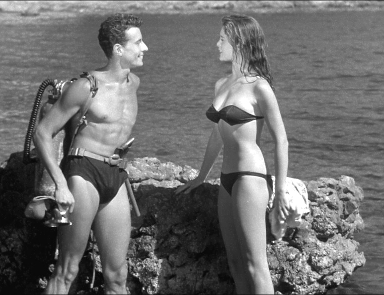 Elegant style icon wardrobe essentials: Brigitte Bardot in swimwear, a two piece bikini in black