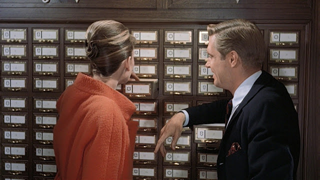 Audrey Hepburn movie costume in film Breakfast at Tiffany's(1961), the complete wardrobe of Holly Golightly:Orange double breast wool coat with standup collar and 3 quarter sleeves