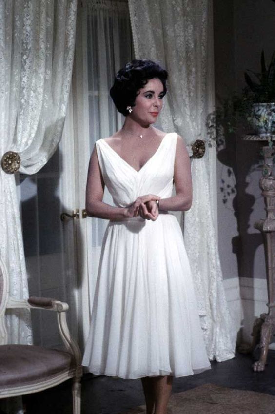 Elizabeth Taylor in film Cat on a Tin Roof( 1958), wearing a white chiffon dress designed by Helen Rose