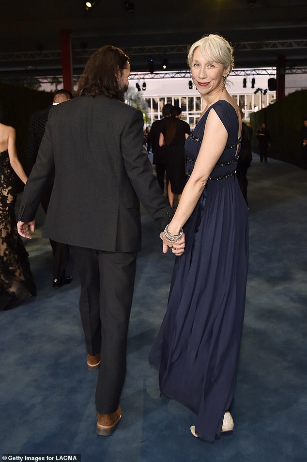 Keanu Reeves and his new artist girl friend in grey