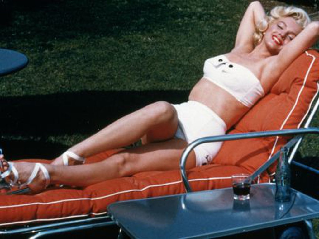 Elegant style icon wardrobe essentials: Marilyn Monroe in swimwear, a two piece strapless bikini