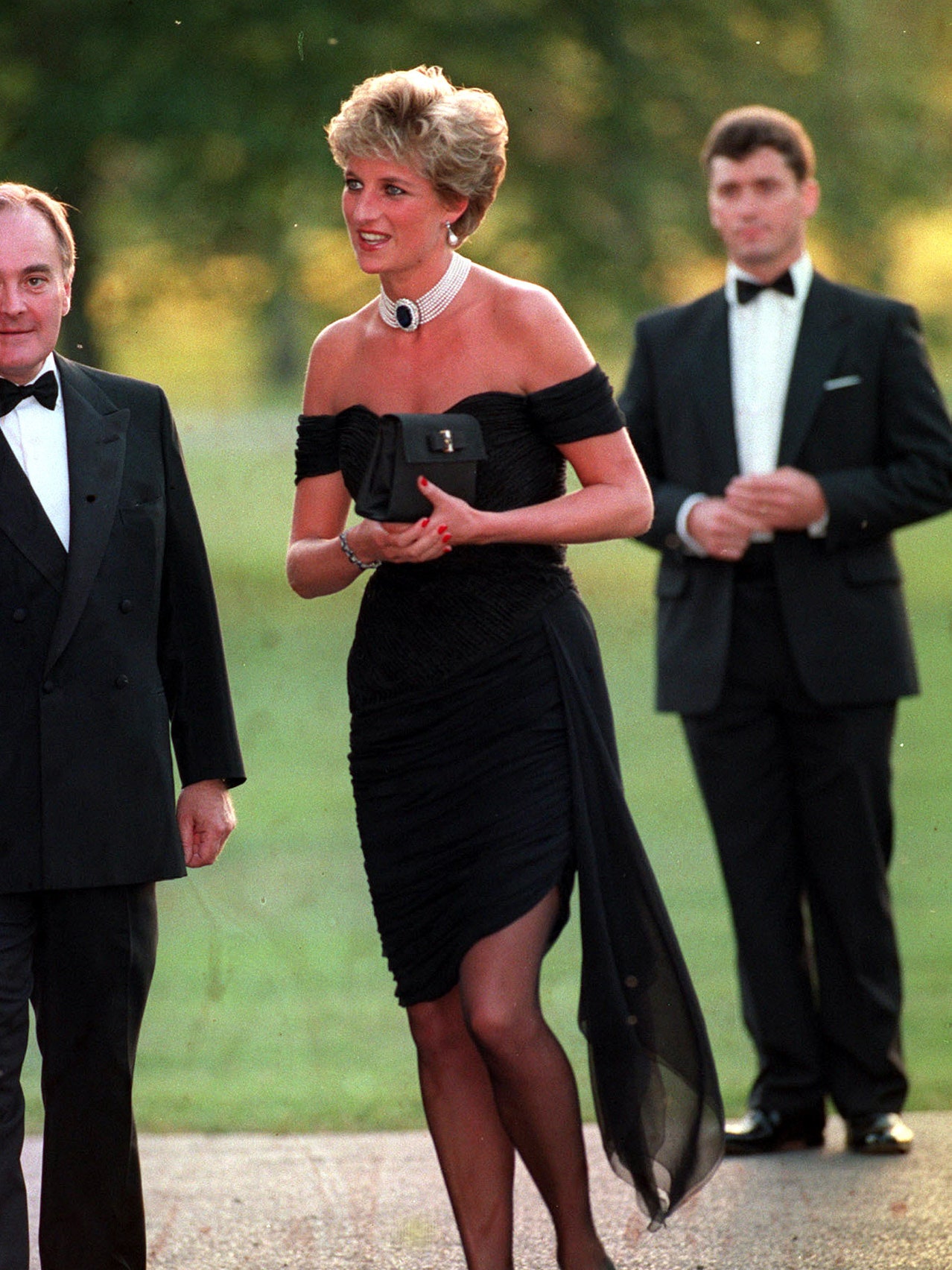 Elegant style icon wardrobe essentials: The Little Black Dress: Princess Diana in black dress designed by Christina Stambolian, the Revenge dress, June 1994