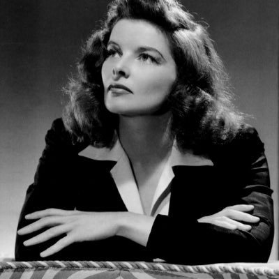 Elegant style icon wardrobe essentials: Kathrine Hepburn in white shirt