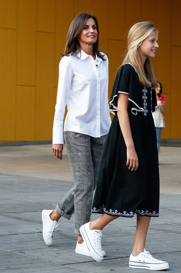 Elegant style icon wardrobe essentials: Queen Letizia of Spain in white shirt