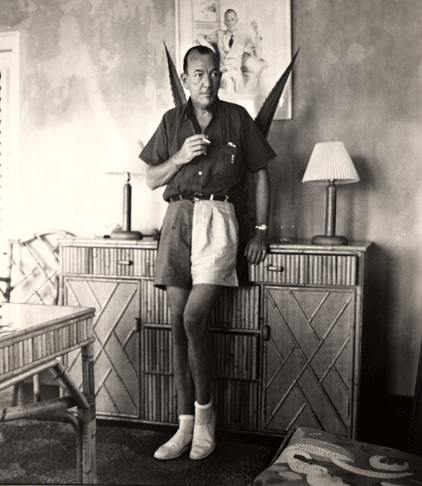Noel Coward in two toned shorts