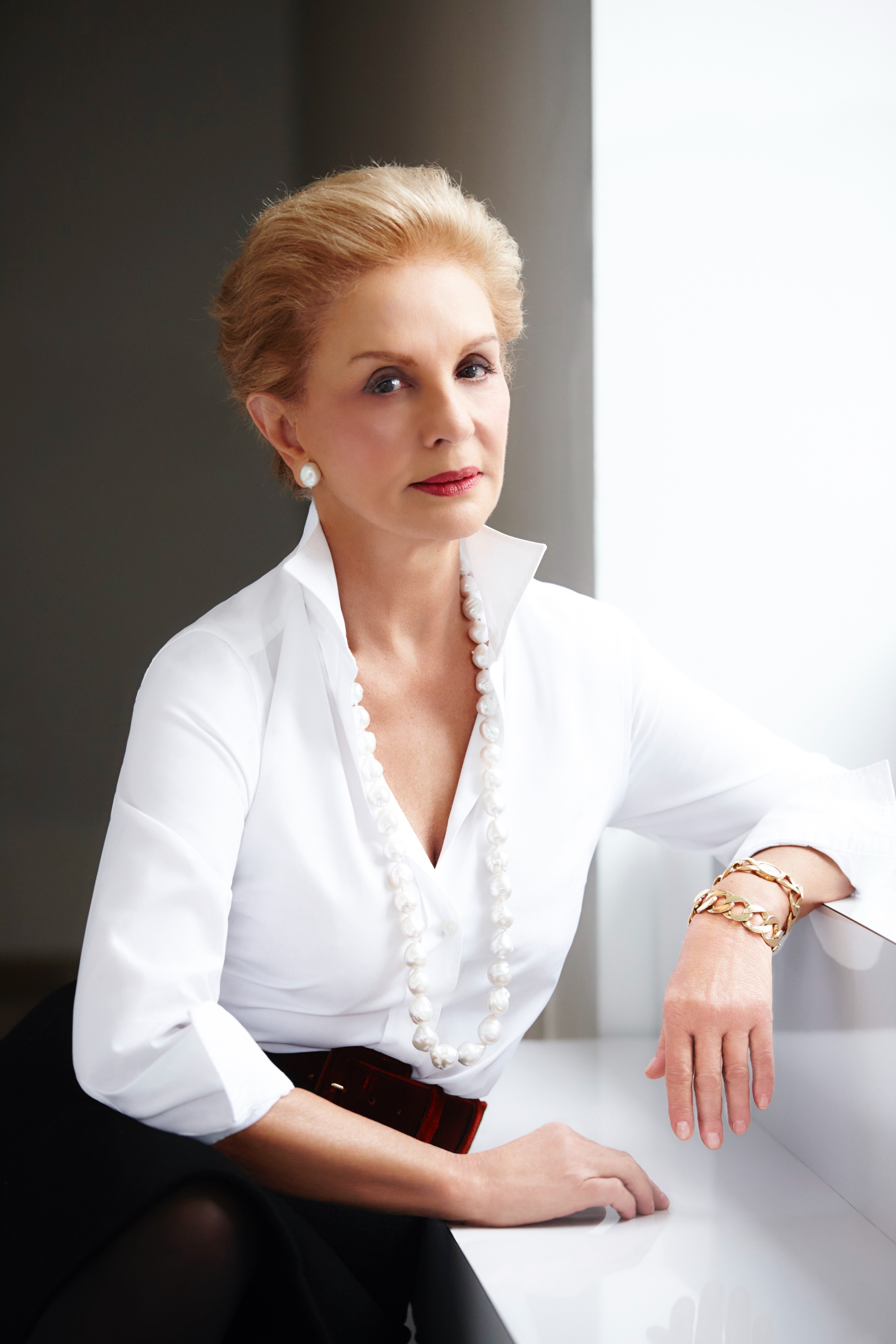 Elegant style icon wardrobe essentials: Carolina Herrera in white shirt