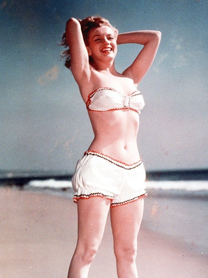 Elegant style icon wardrobe essentials: Marilyn Monroe in swimwear, a two piece strapless bikini
