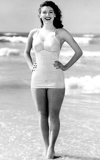 Elegant style icon wardrobe essentials: Ava Gardner in swimwear, a one piece swimsuit in print