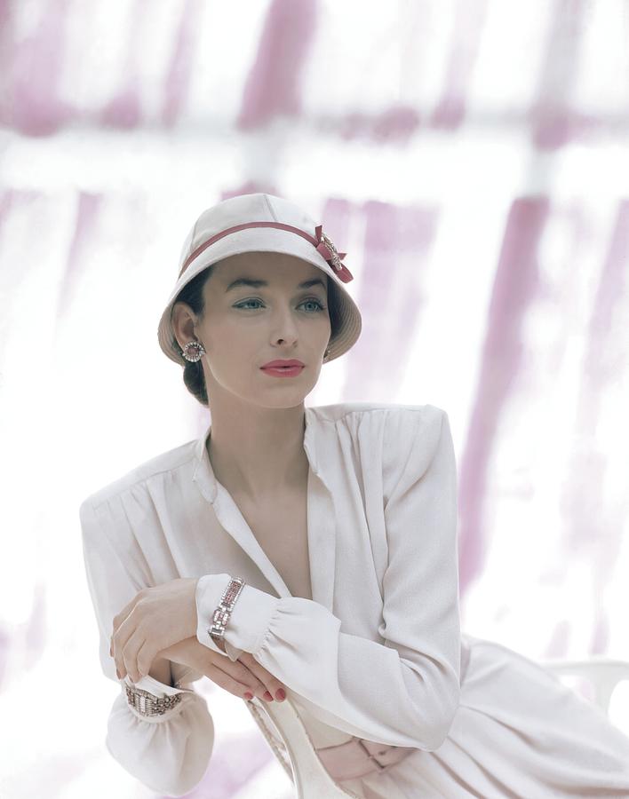 Dorian Leigh Wearing A Pale Pink Cloche, photo by John Rawlings(1912-1979)