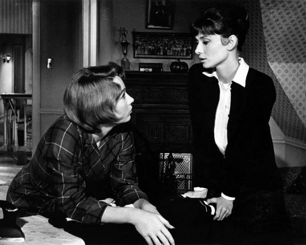 Elegant style icon wardrobe essentials: Audrey Hepburn in cardigan sweater,  in film The Children's Hour, 1961