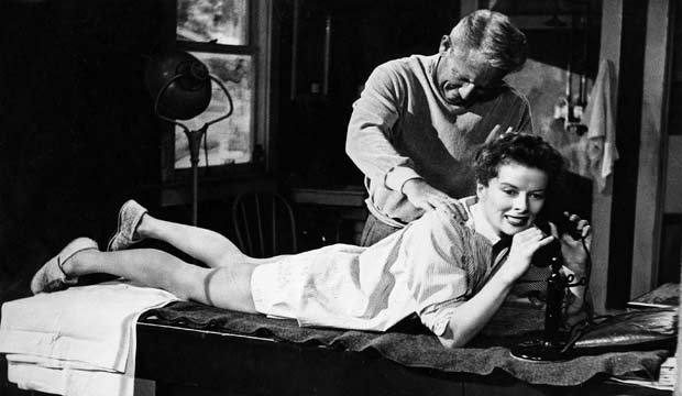 Elegant style icon wardrobe essentials: Kathrine Hepburn in white shirt