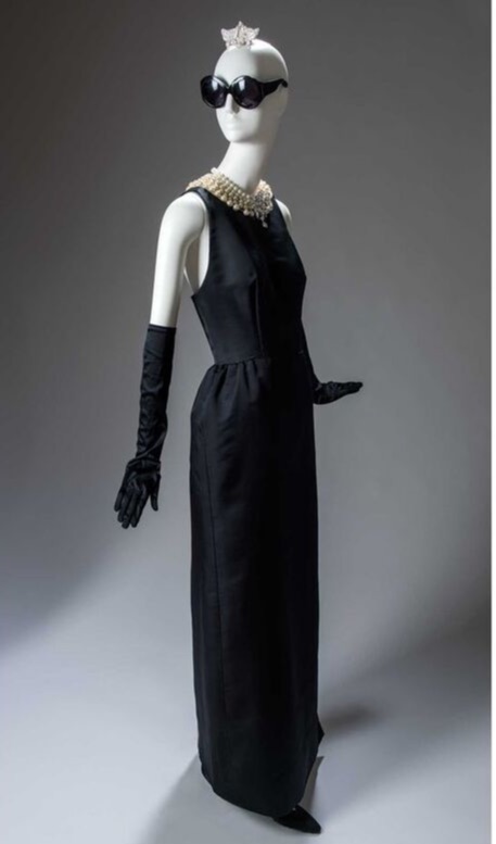 Audrey Hepburn movie costume in film Breakfast at Tiffany's(1961), the complete wardrobe of Holly Golightly:Black floor length sleeveless dress with moonlike back cut-out