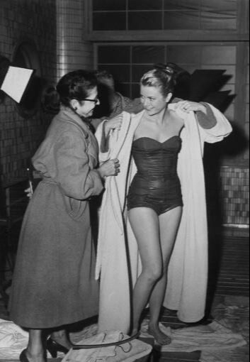 Elegant style icon wardrobe essentials: Grace Kelly in swimwear, a strapless one piece swimming suit, in film The Bridges at Toko-Ri(1954)
