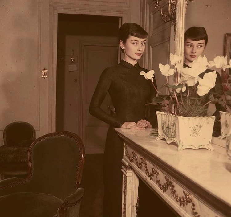 Elegant style icon wardrobe essentials: Audrey Hepburn in little black dress, photo by Jack Garofalo, 1955