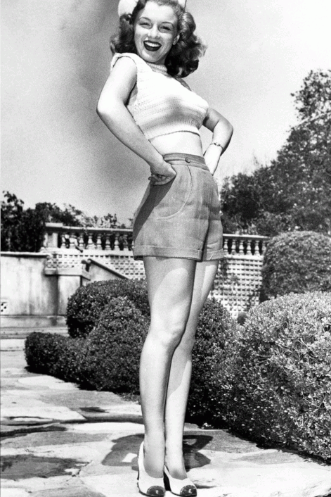 Elegant style icon wardrobe essentials: A pair of high-waist shorts: Marilyn Monroe in a pair of high waist shorts 