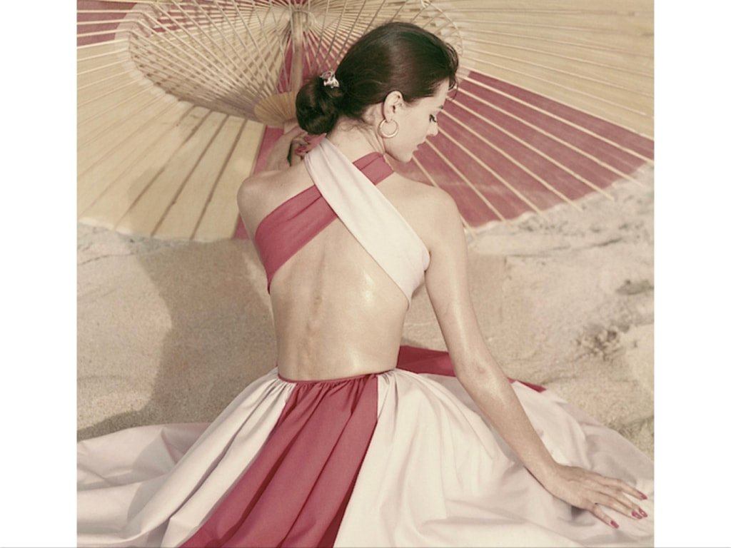 Carla Marlierin criss-cross backless dress by Robert Sloane, hoop earringsby Tiffany & Co.Glamour, April 1, 1960  © Frances McLaughlin-Gill