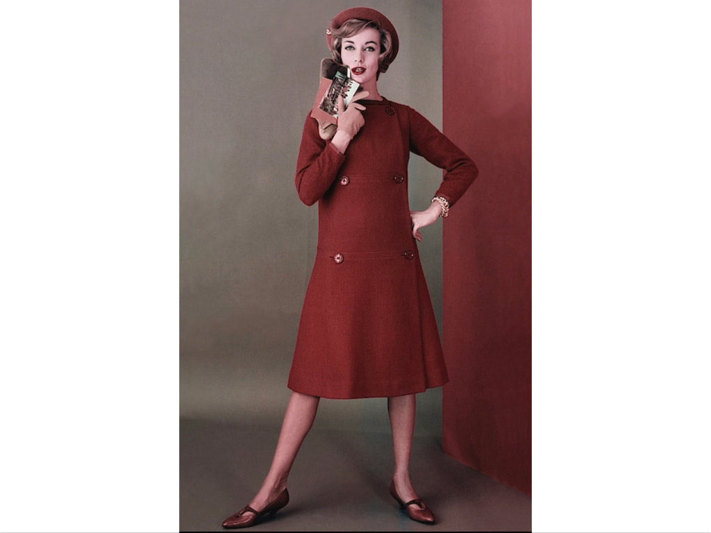 Model in a tunic and wool dress with shoes by Capezio and gloves by Meyers Make glam Glamour, August 1958 © Frances McLaughlin-Gill