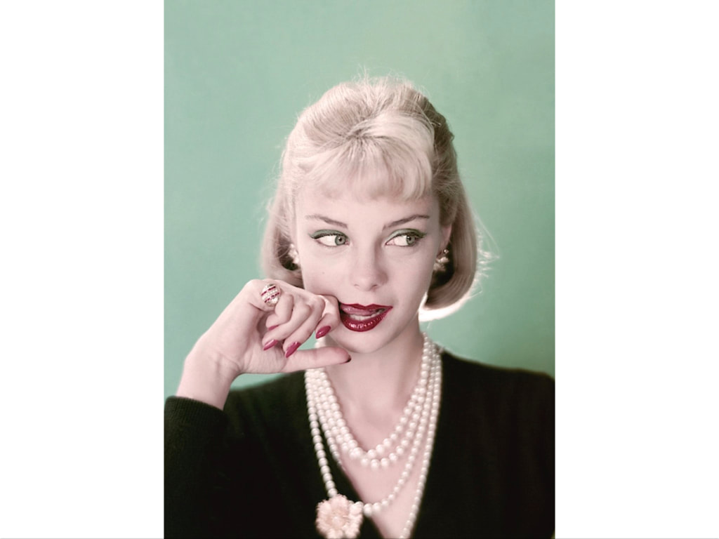 Gretchen Harris,wearing floral blouse by Jeanne Campbell, pearls, by Ciner and headband by Emily Wetherby glamGlamour, April 1957© Frances McLaughlin-Gill