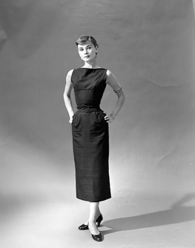 Elegant style icon wardrobe essentials: Audrey Hepburn in little black dress on the set of film Sabrina, 1953