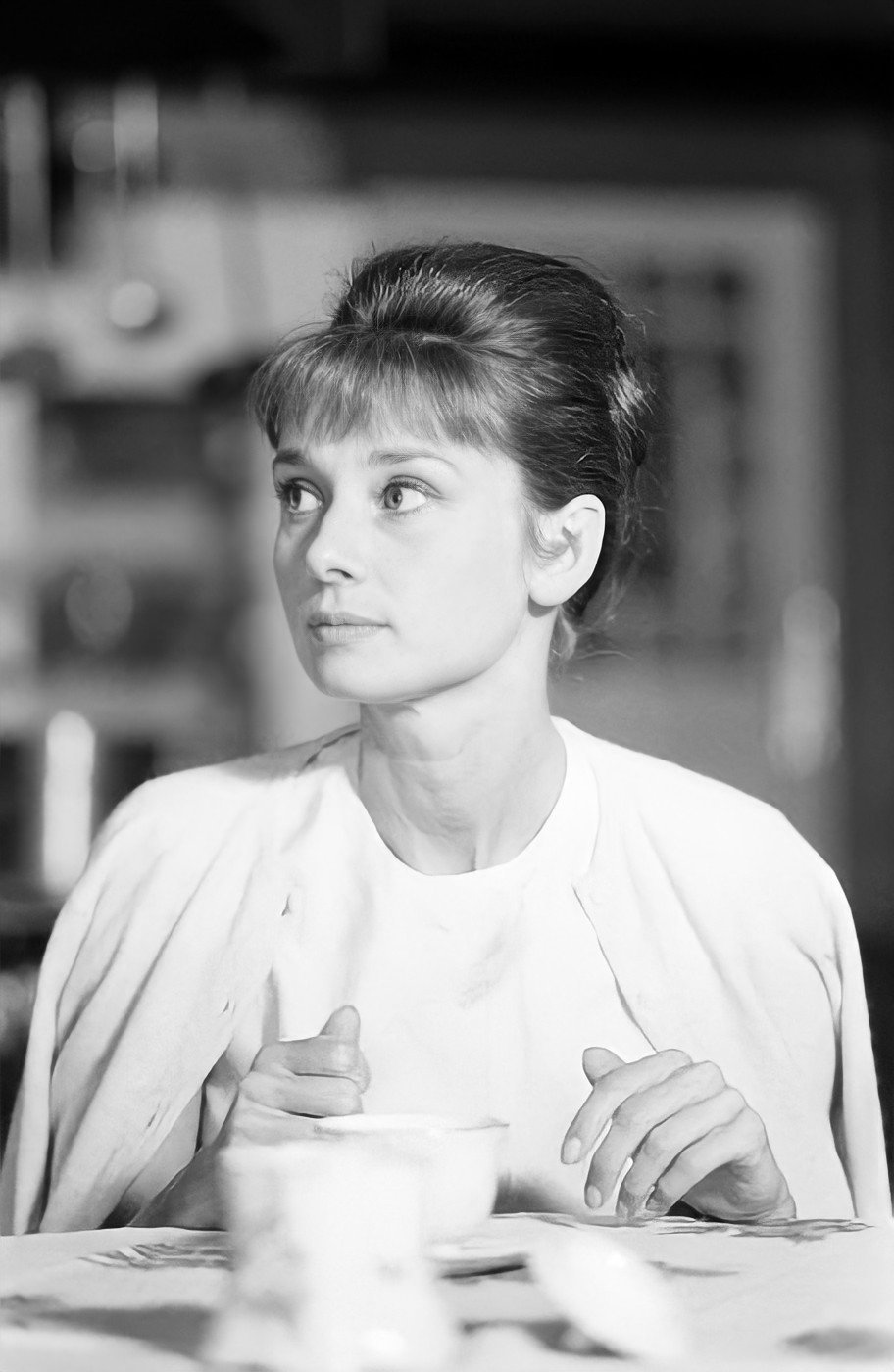 Elegant style icon wardrobe essentials: Audrey Hepburn in cardigan sweater