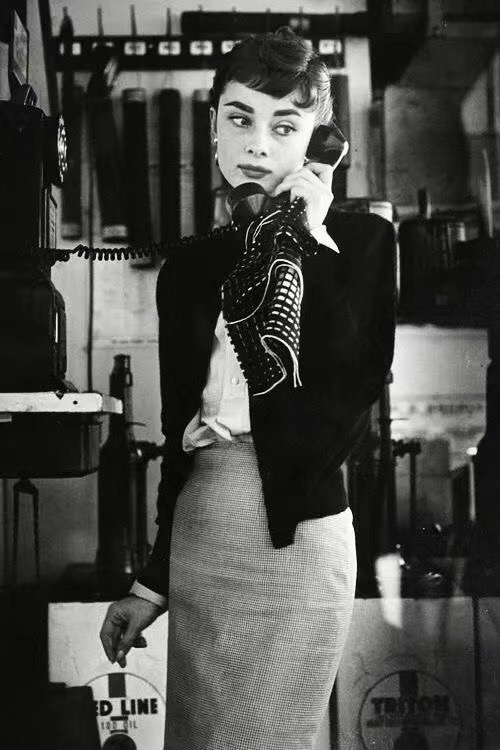 Elegant style icon wardrobe essentials: Audrey Hepburn in cardigan sweater