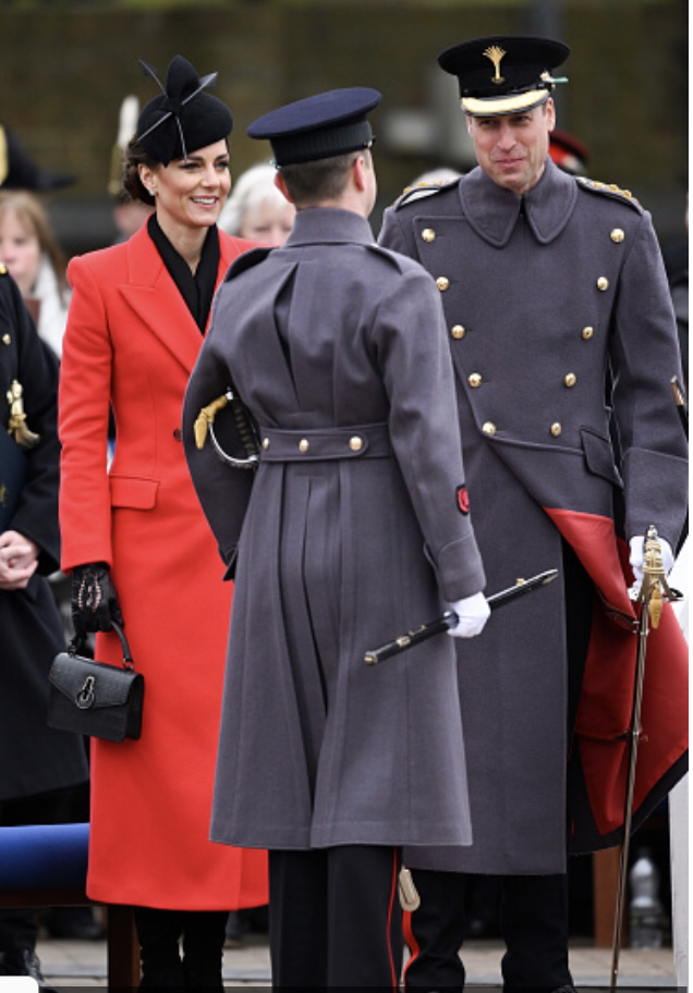 Kate Middleton in custom made red Alexander McQueen double-breast midi coat, 1 March 2023. Getty Images