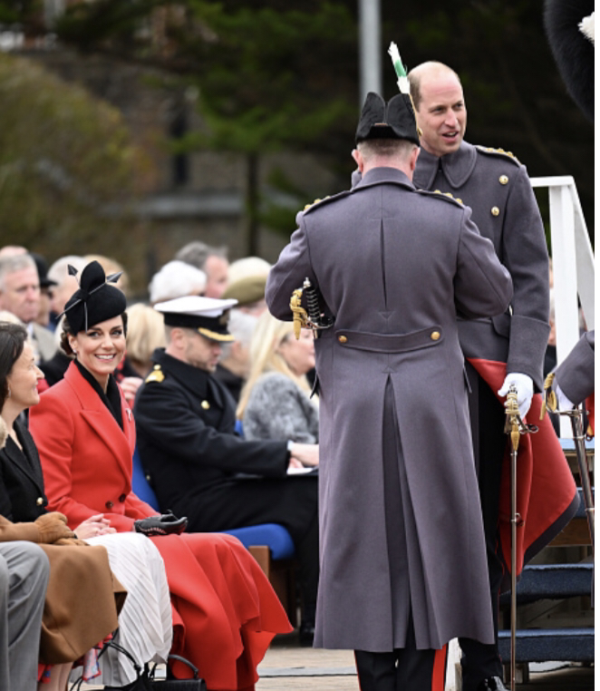 Kate Middleton in custom made red Alexander McQueen double-breast midi coat, 1 March 2023. Getty Images
