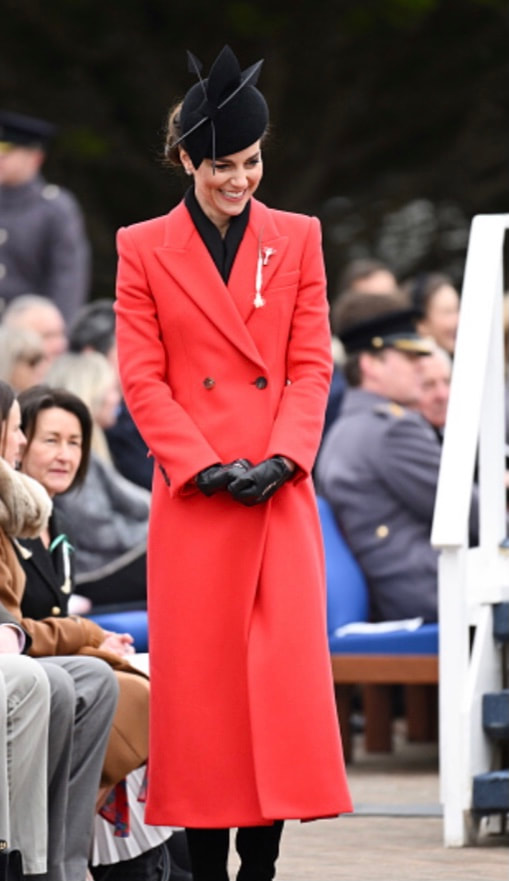 Kate Middleton in custom made red Alexander McQueen double-breast midi coat, 1 March 2023. Getty Images