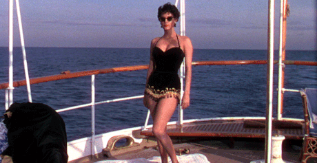 Elegant style icon wardrobe essentials: Ava Gardner in swimwear, a one piece swimsuit in black, in film The Barefoot Contessa(1954)
