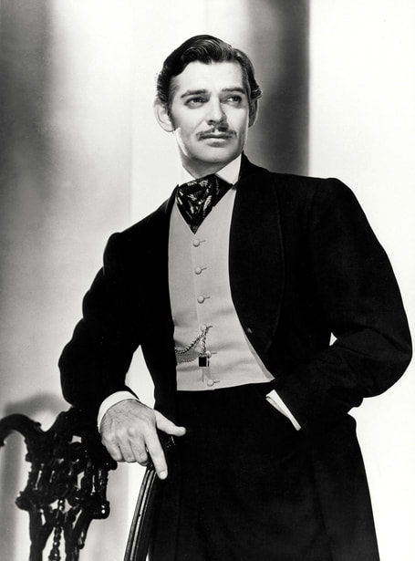 Clark Gable as Rhett Butler in a dark frock coat and cravat, Gone with the Wind (1939)